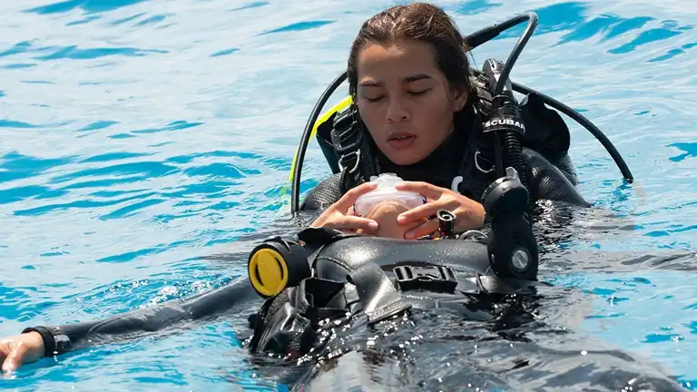 Scuba diving Perhentian Island : An image of a PADI rescue diver doing training course with Perhentian Island PADI Courses